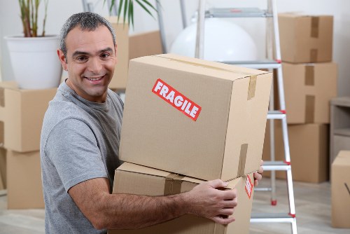 Moving home in Ilford with boxes and furniture ready for transport