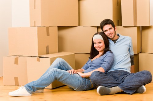 Careful unpacking of household items into a new Ilford property