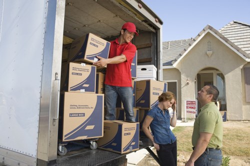 Loading boxes and furniture into a removal truck