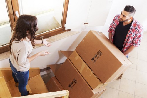 Business moving team loading office equipment for relocation